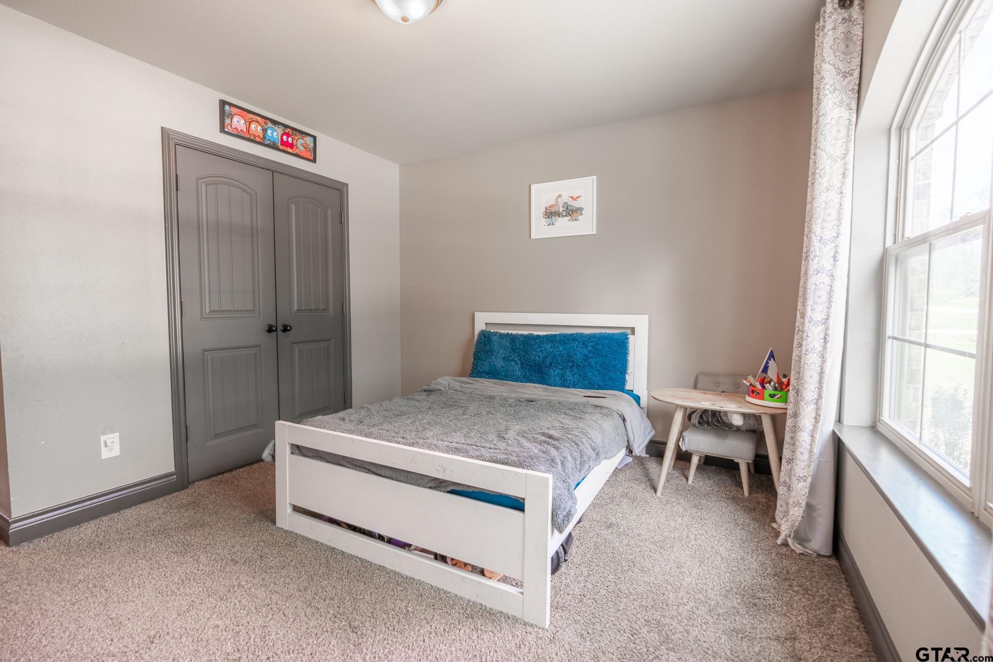 14062 Bent Trail Tyler, TX 75707 - Photo 19 of 46 a bedroom with a bed and a window