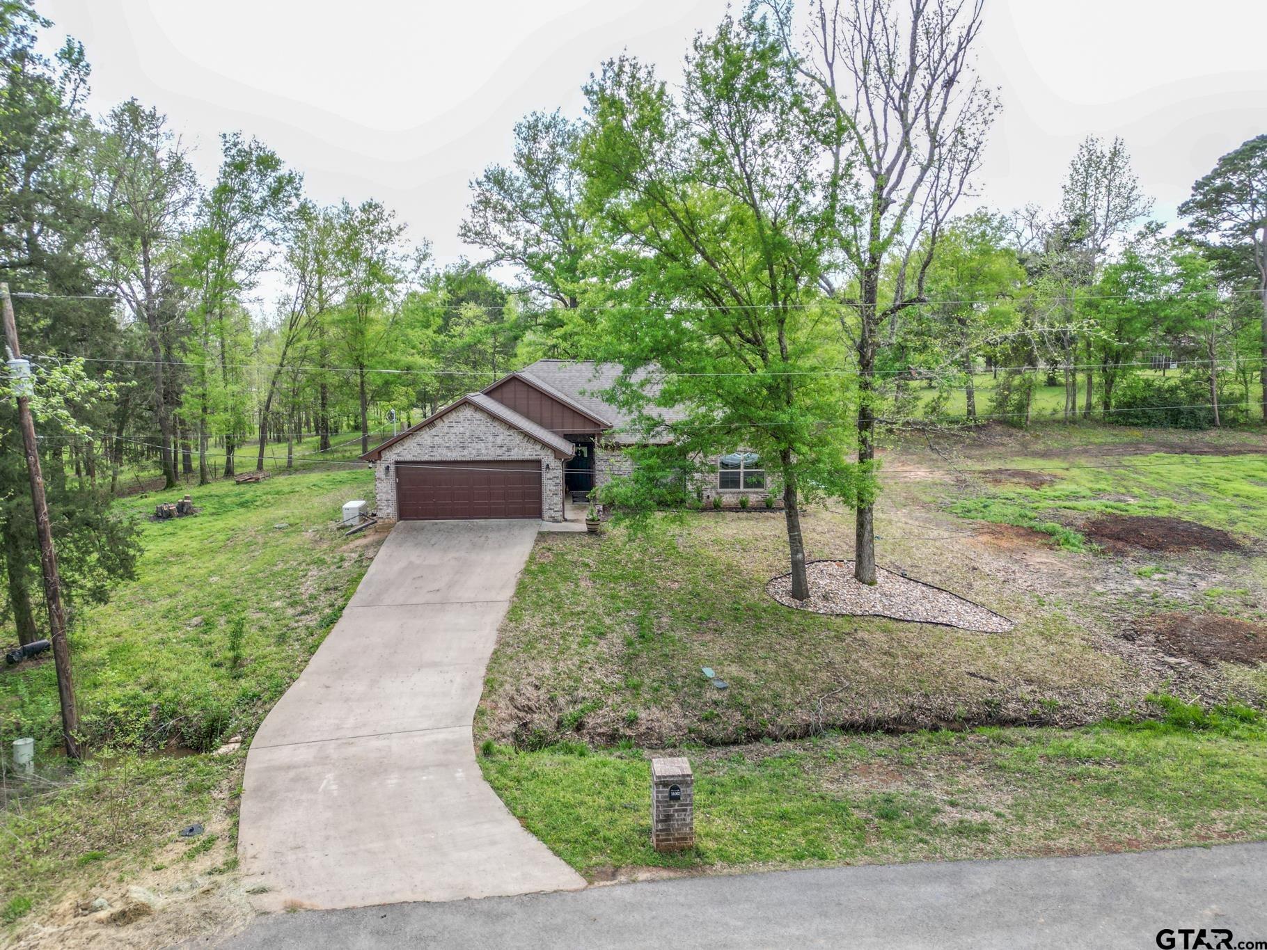 14062 Bent Trail Tyler, TX 75707 - Photo 2 of 46 a front view of a house with a yard