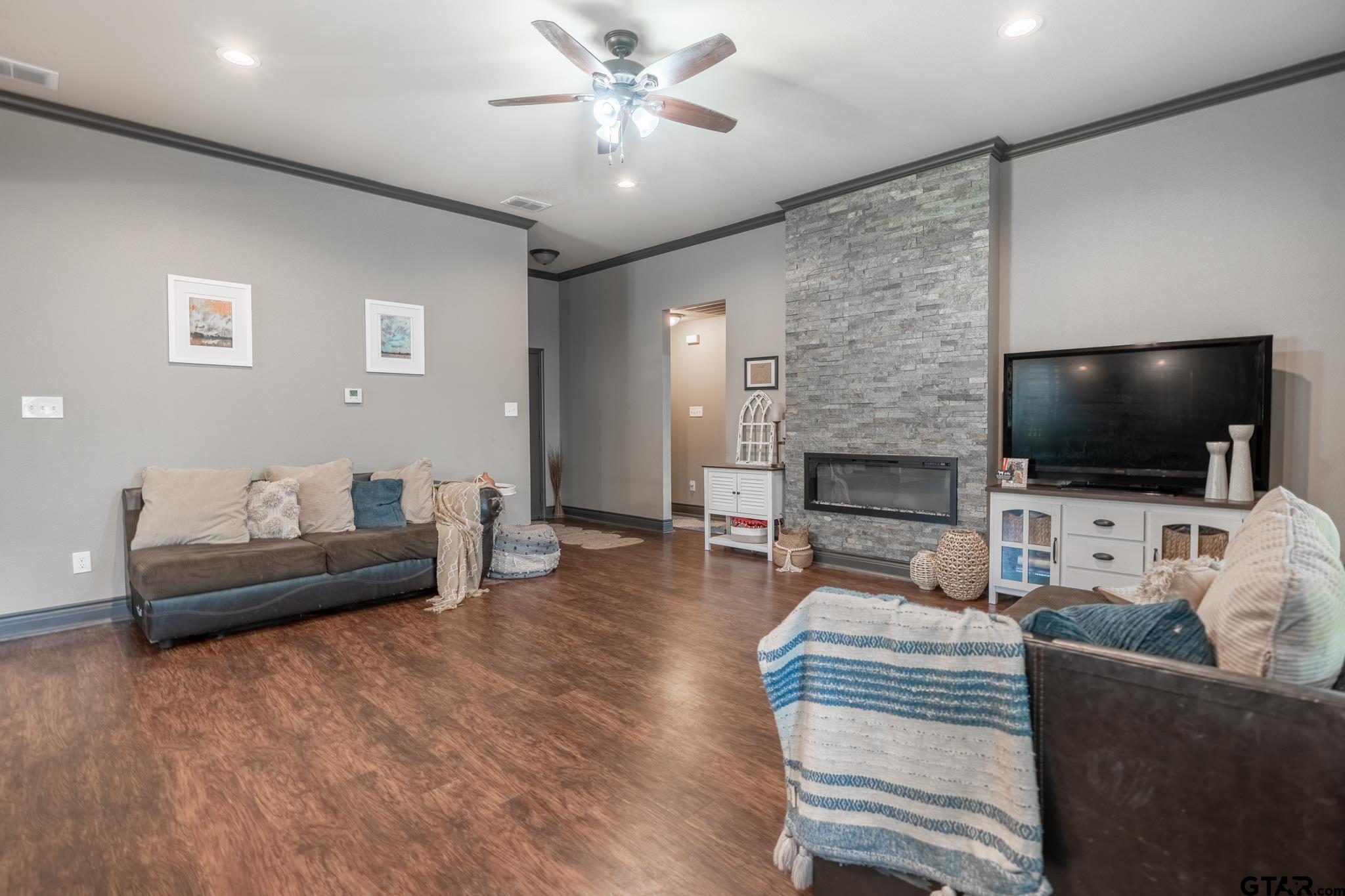 14062 Bent Trail Tyler, TX 75707 - Photo 20 of 46 a living room with furniture and a flat screen tv