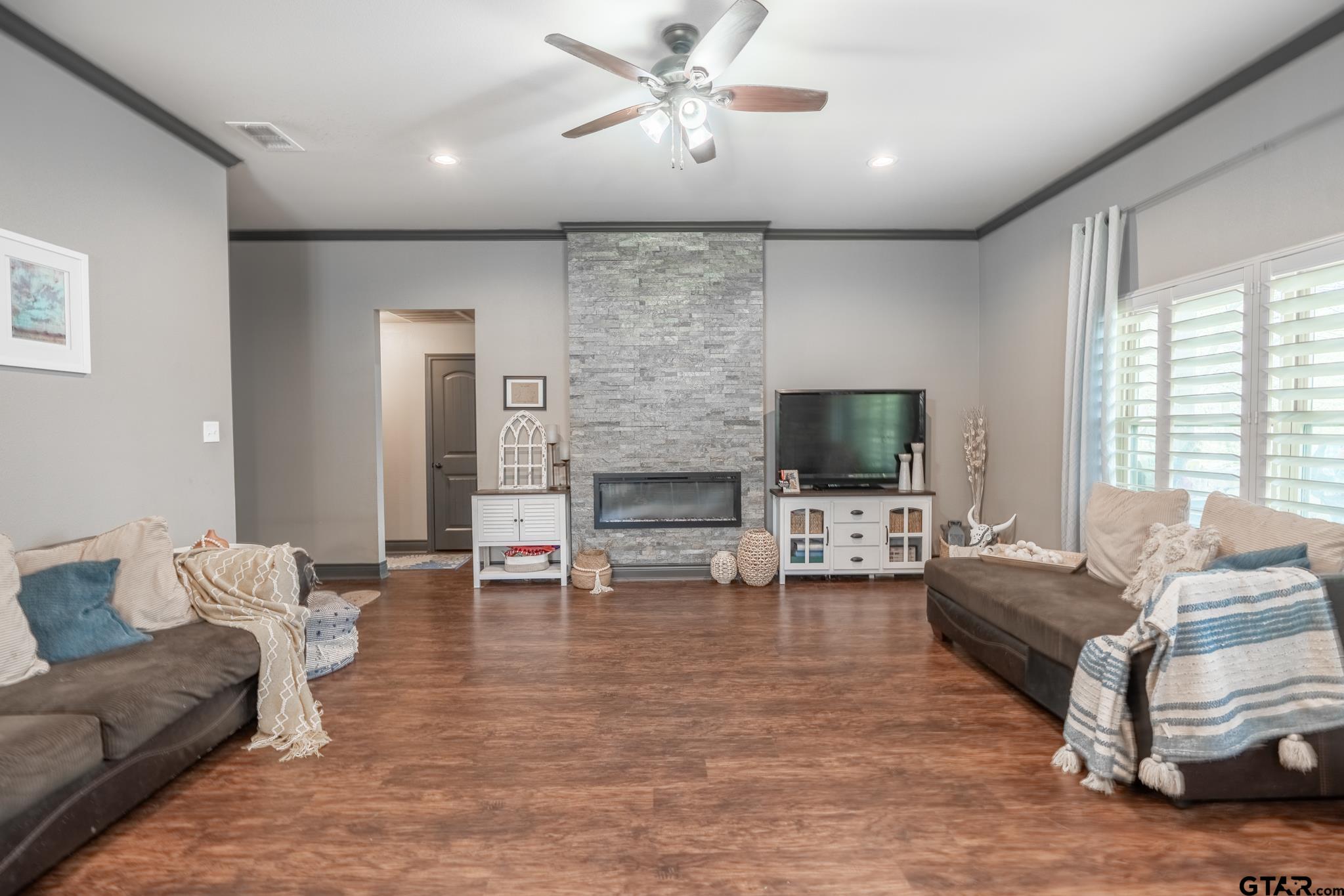 14062 Bent Trail Tyler, TX 75707 - Photo 21 of 46 a living room with furniture and a fireplace