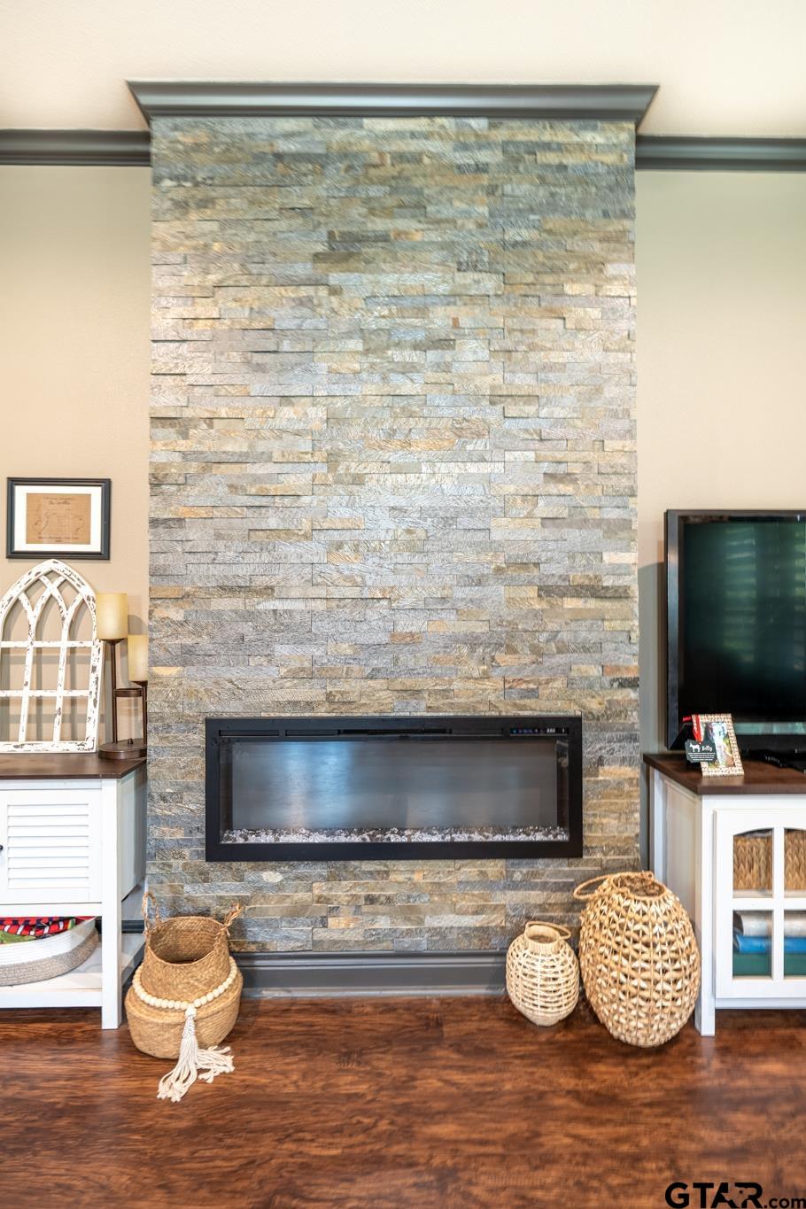 14062 Bent Trail Tyler, TX 75707 - Photo 22 of 46 a living room with furniture and a flat screen tv