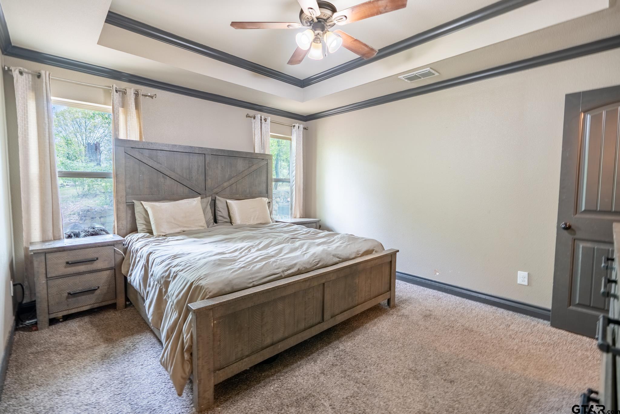 14062 Bent Trail Tyler, TX 75707 - Photo 26 of 46 a bedroom with a bed and a window