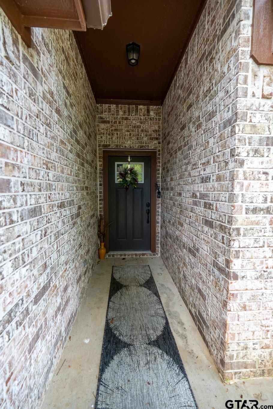 14062 Bent Trail Tyler, TX 75707 - Photo 3 of 46 a hallway with a door front of a house