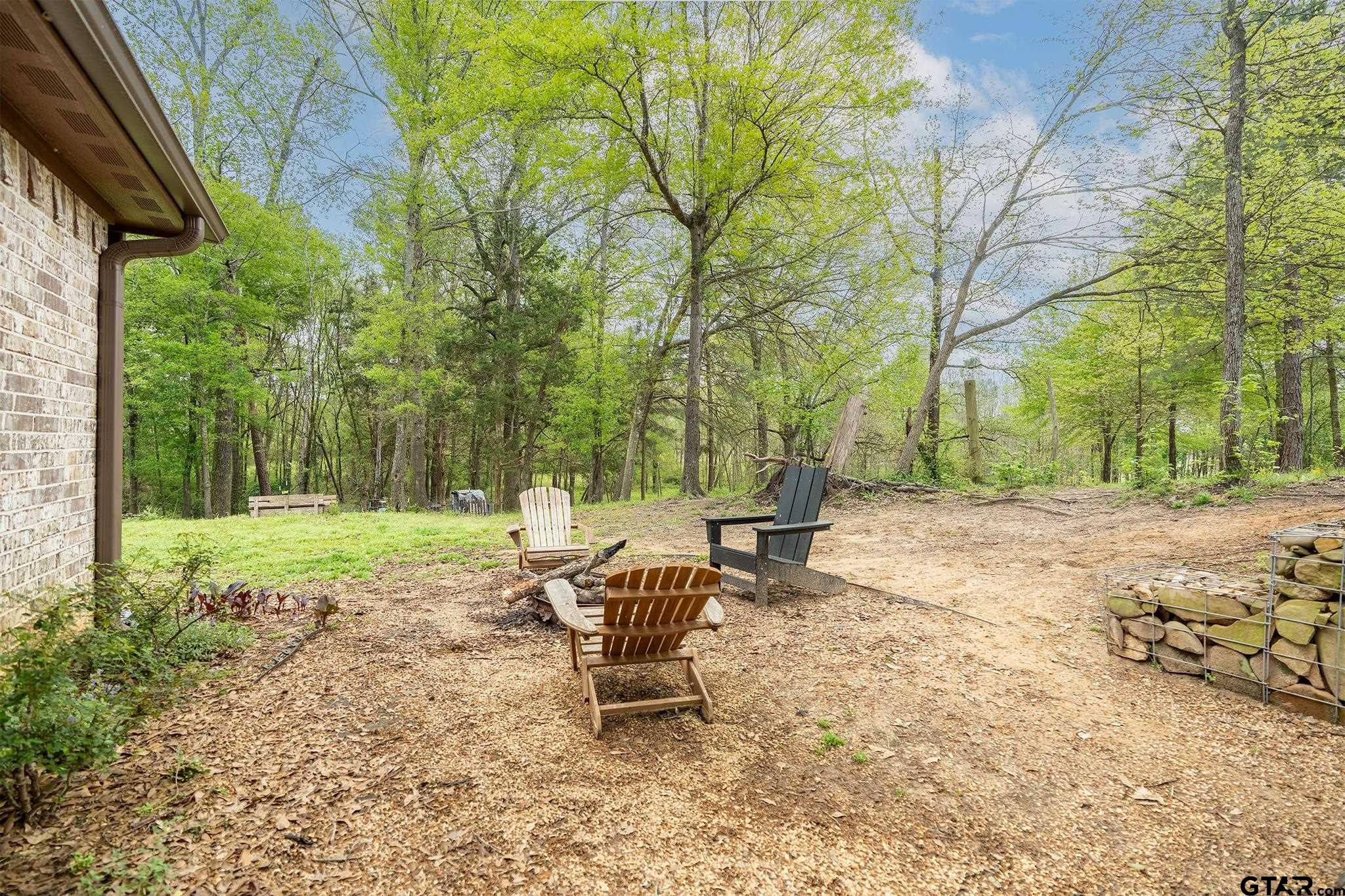 14062 Bent Trail Tyler, TX 75707 - Photo 34 of 46 a view of a backyard with a patio