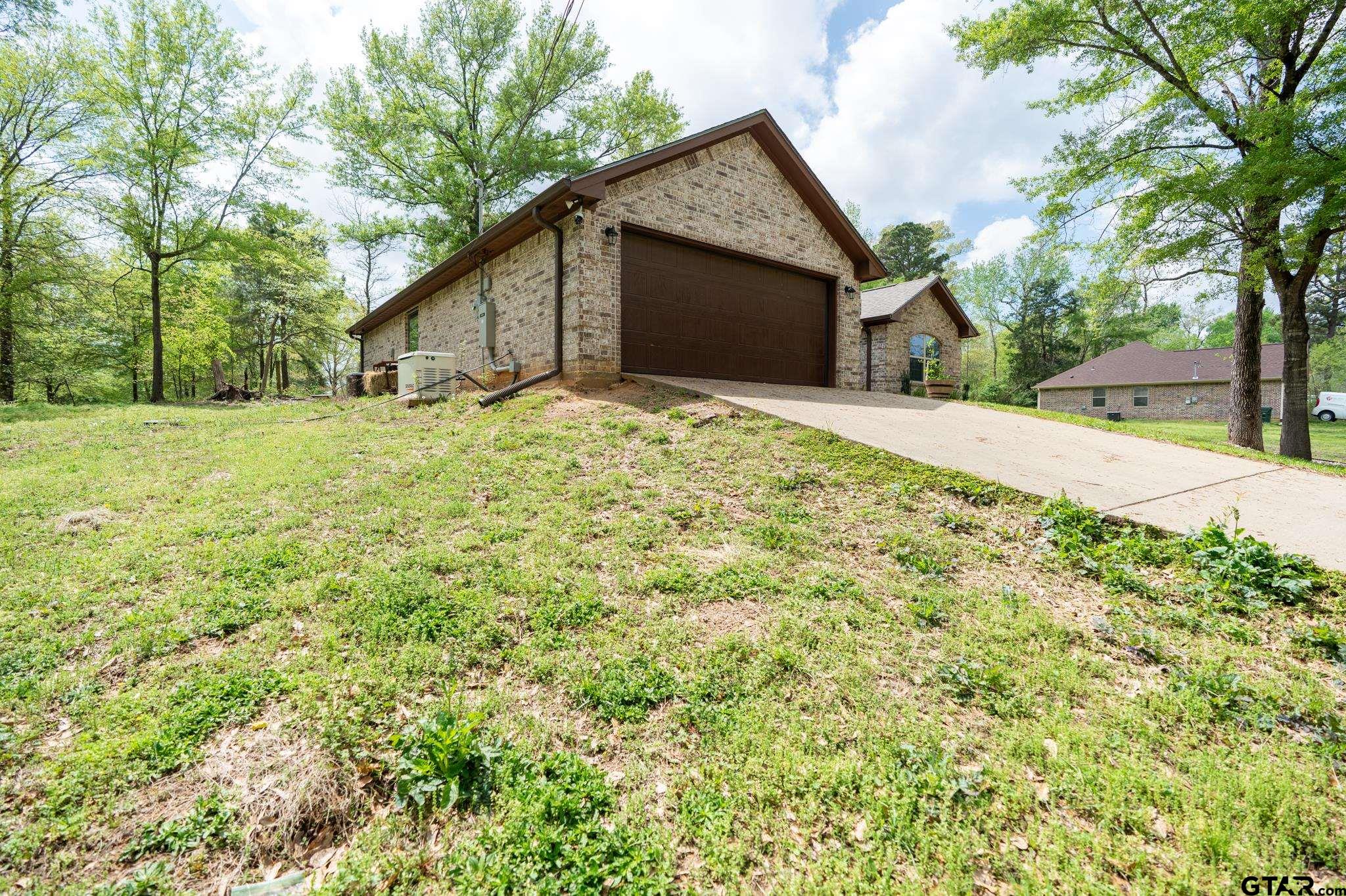 14062 Bent Trail Tyler, TX 75707 - Photo 37 of 46 a yellow house with a yard