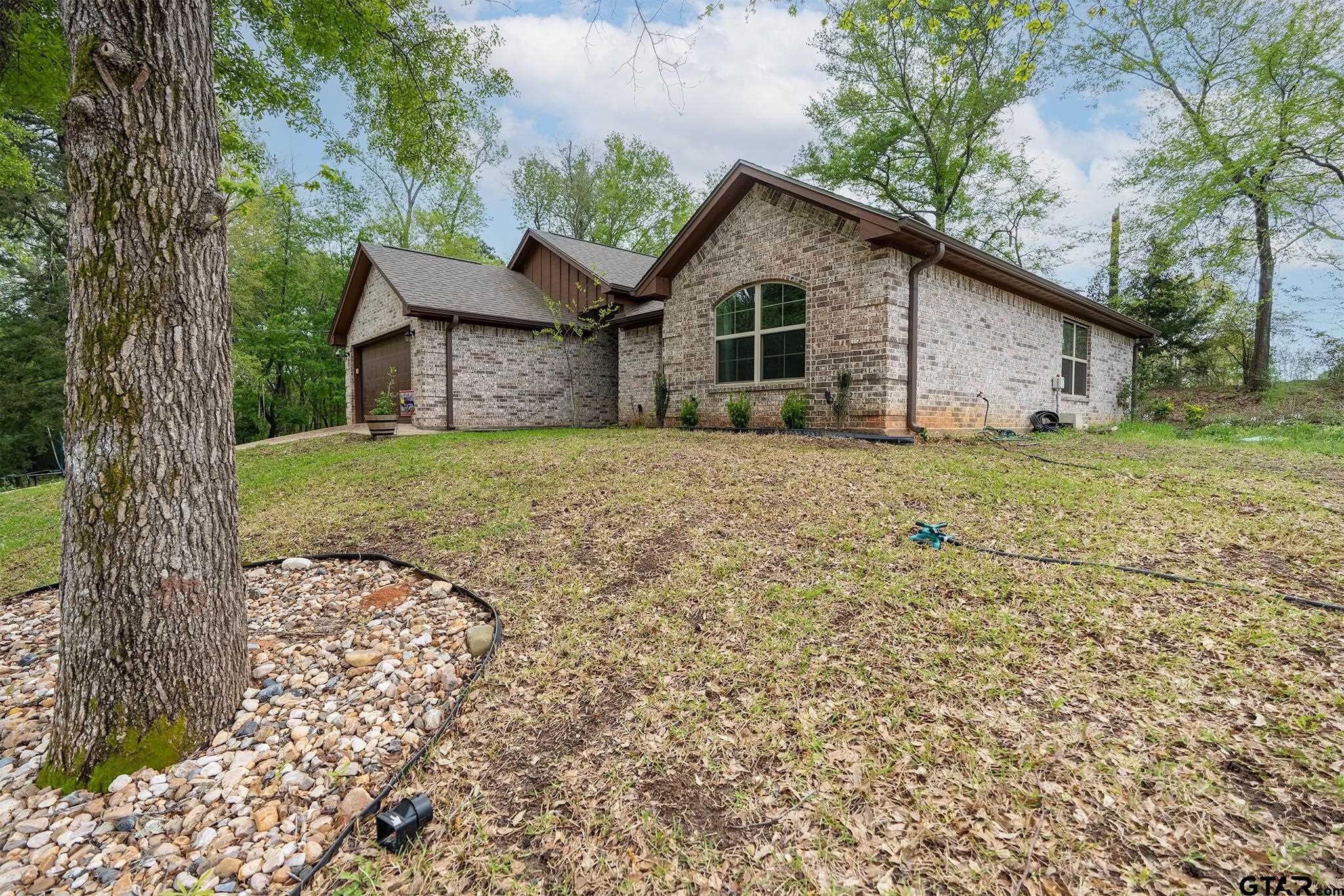 14062 Bent Trail Tyler, TX 75707 - Photo 38 of 46 a view of a house with a yard