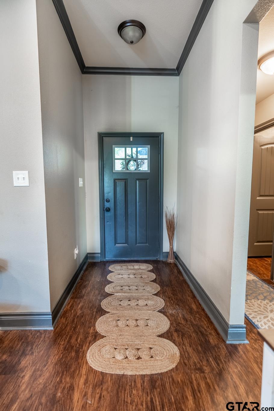 14062 Bent Trail Tyler, TX 75707 - Photo 4 of 46 an empty room with wooden floor and windows