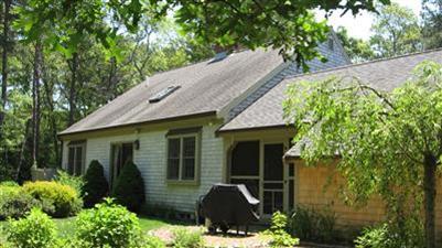 32 Tracey Road Cotuit, MA 02635 - Photo 3 of 28 a front view of a house with garden