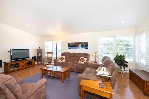 a bedroom with a bed and a table