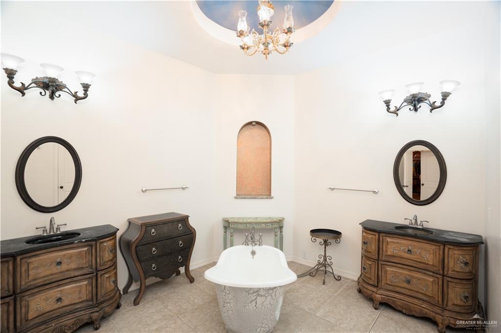 508 El Paisano Road Rio Grande City, TX 78582 - Photo 16 of 40 a bathroom with a toilet sink and mirror
