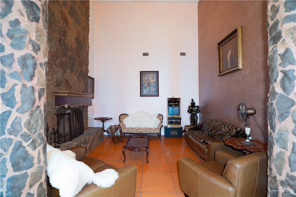 508 El Paisano Road Rio Grande City, TX 78582 - Photo 21 of 40 a living room with furniture and a fireplace