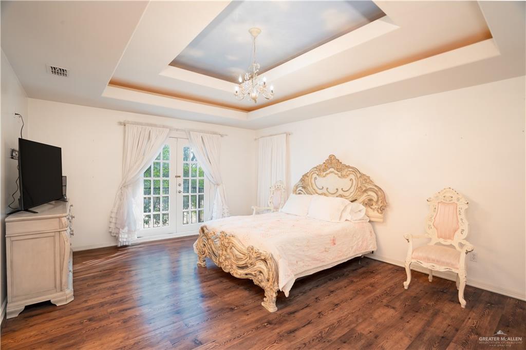 508 El Paisano Road Rio Grande City, TX 78582 - Photo 25 of 40 a spacious bedroom with a bed and a tv on table