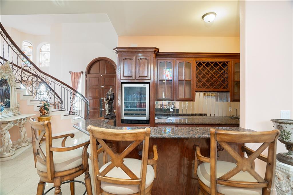 508 El Paisano Road Rio Grande City, TX 78582 - Photo 37 of 40 a dinning table and chairs in a kitchen