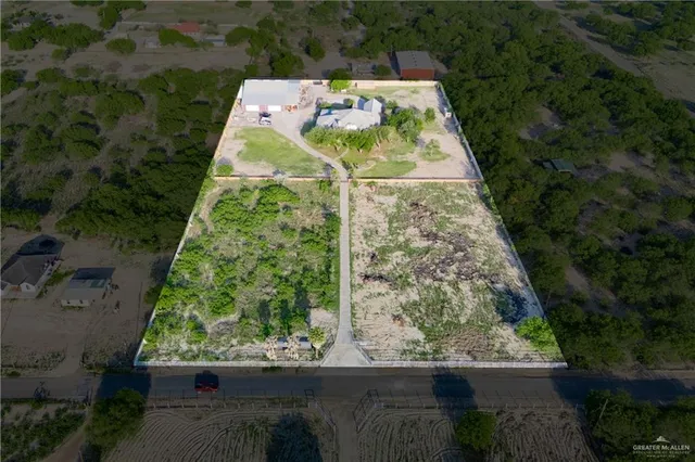 an aerial view of house with yard