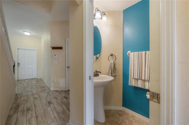 a bathroom with a sink and mirror