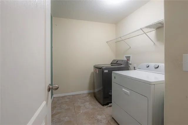 a utility room with dryer and washer