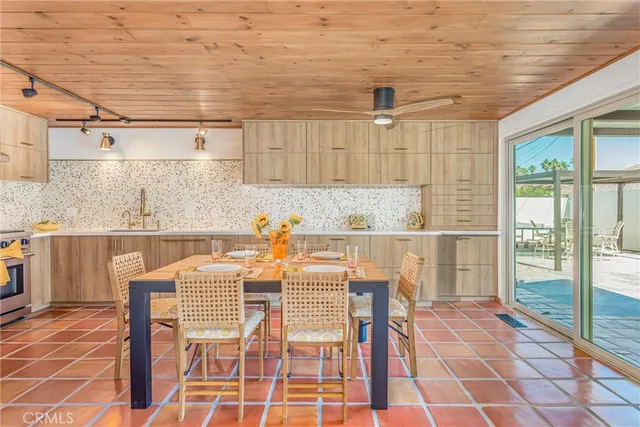 a dining room with a table and chairs