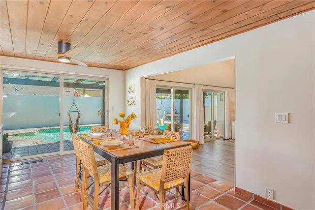 a outdoor space with a table and chairs