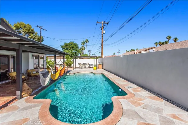 a view of a backyard with sitting area