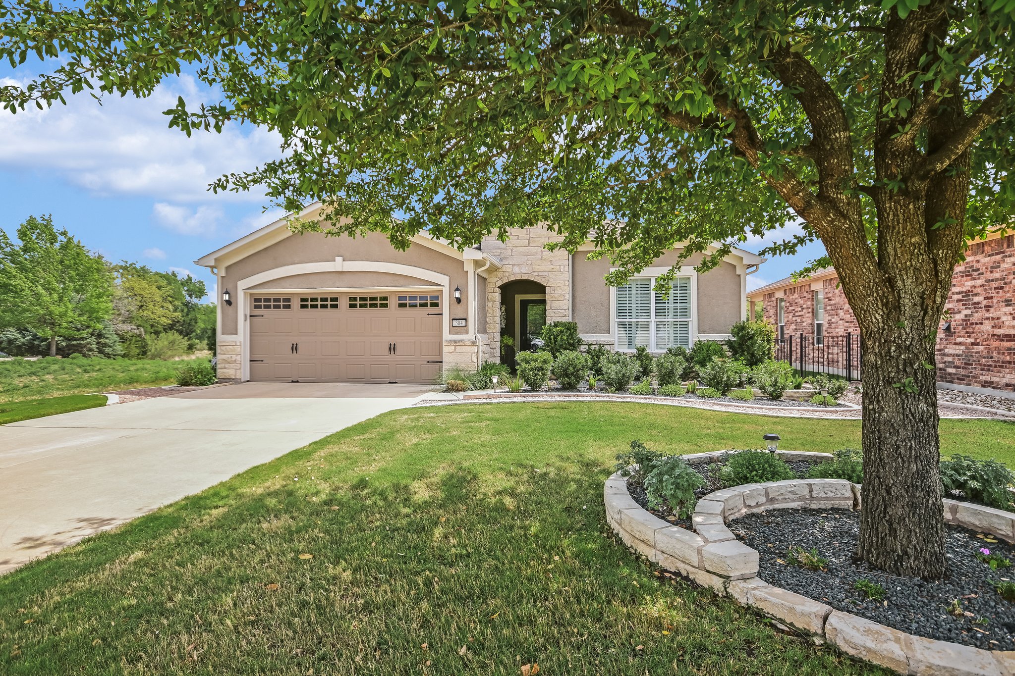 304 Coffee Mill Creek Road Georgetown, TX 78633 - Photo 29 of 30 Welcome to 304 Coffee Mill Creek Rd, pristine Vernon Hill floorplan with a stone and stucco exterior on all four sides, finished two car garage, privately situated in a quiet cul-de-sac on a greenbelt lot