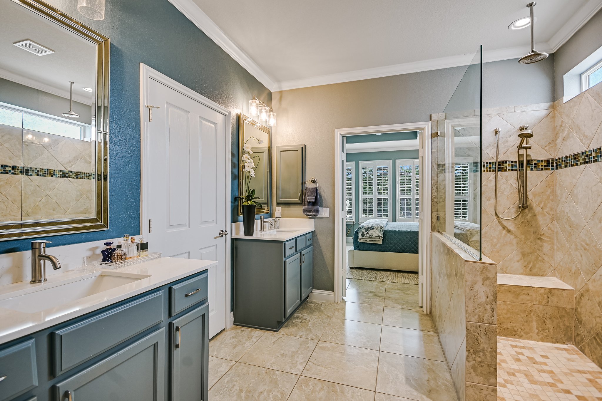 304 Coffee Mill Creek Road Georgetown, TX 78633 - Photo 15 of 30 Primary bathroom has been updated with quartz counter tops, lighting mirrors, new sinks, painted cabinetry and accent shower tile