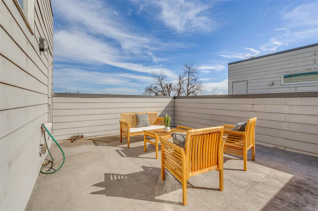 4610 Steel Street Dallas, TX 75219 - Photo 3 of 18 a view of an outdoor sitting area with brick walls