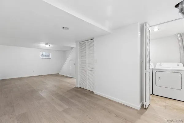 a view of a storage & utility room with a washer dryer