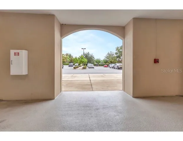 a view of a room with a floor to ceiling window