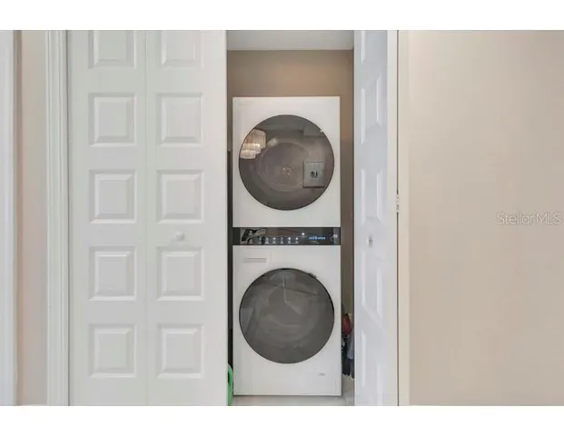 a view of a hallway with washer and dryer