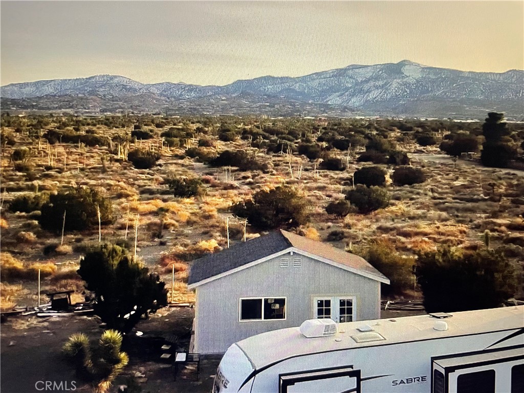 3123 Coyote Road Phelan, CA 92371 - Photo 5 of 7 a view of house and mountains