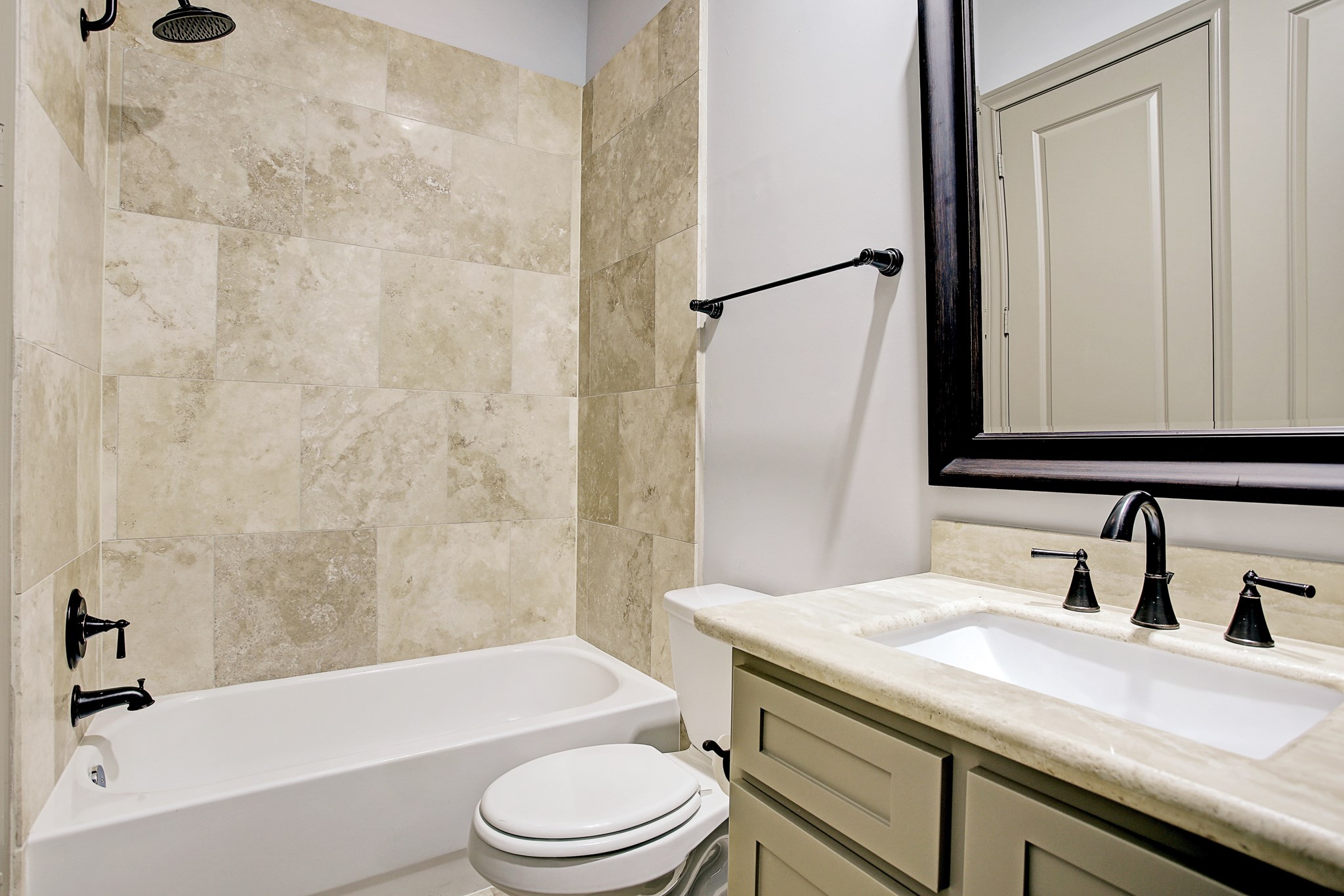 1307 Rosedale Street Houston, TX 77004 - Photo 25 of 32 a bathroom with a granite countertop bathtub shower sink vanity mirror and toilet