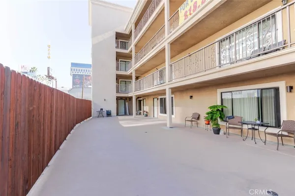a view of a building with sitting area
