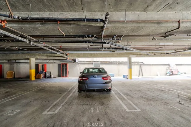 a view of parking garage with cars