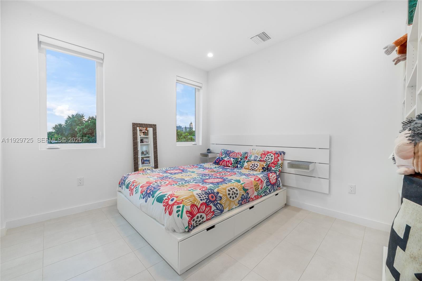 2756 Southwest 34th Court, Unit B Miami, FL 33133 - Photo 16 of 33 a bedroom with a bed and a dresser