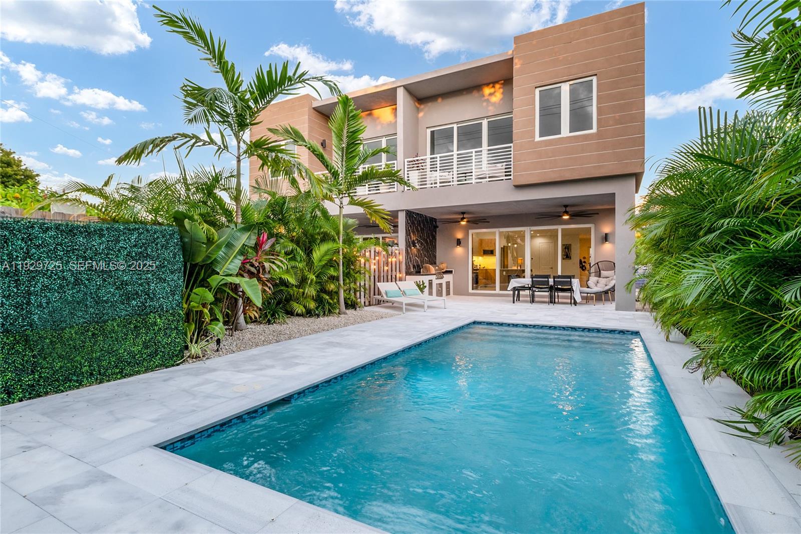 2756 Southwest 34th Court, Unit B Miami, FL 33133 - Photo 25 of 33 a view of a house with swimming pool and sitting area