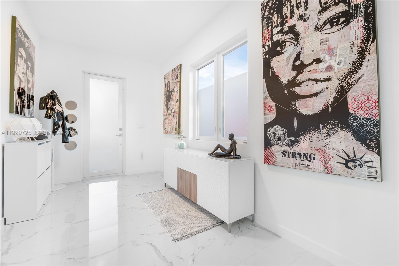 2756 Southwest 34th Court, Unit B Miami, FL 33133 - Photo 3 of 33 a view of a room with window and hardwood floor