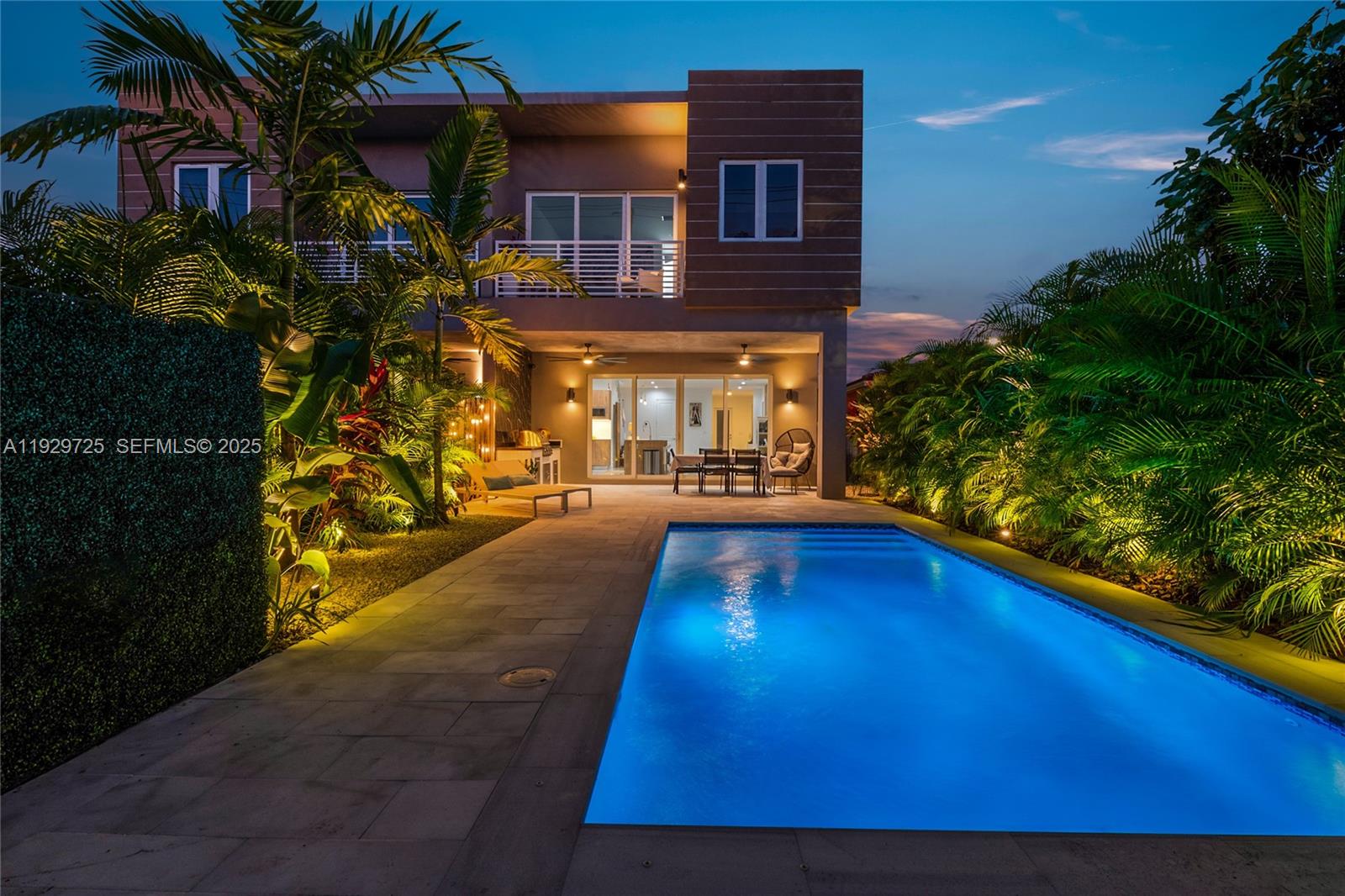 2756 Southwest 34th Court, Unit B Miami, FL 33133 - Photo 31 of 33 a view of swimming pool with outdoor seating and a yard