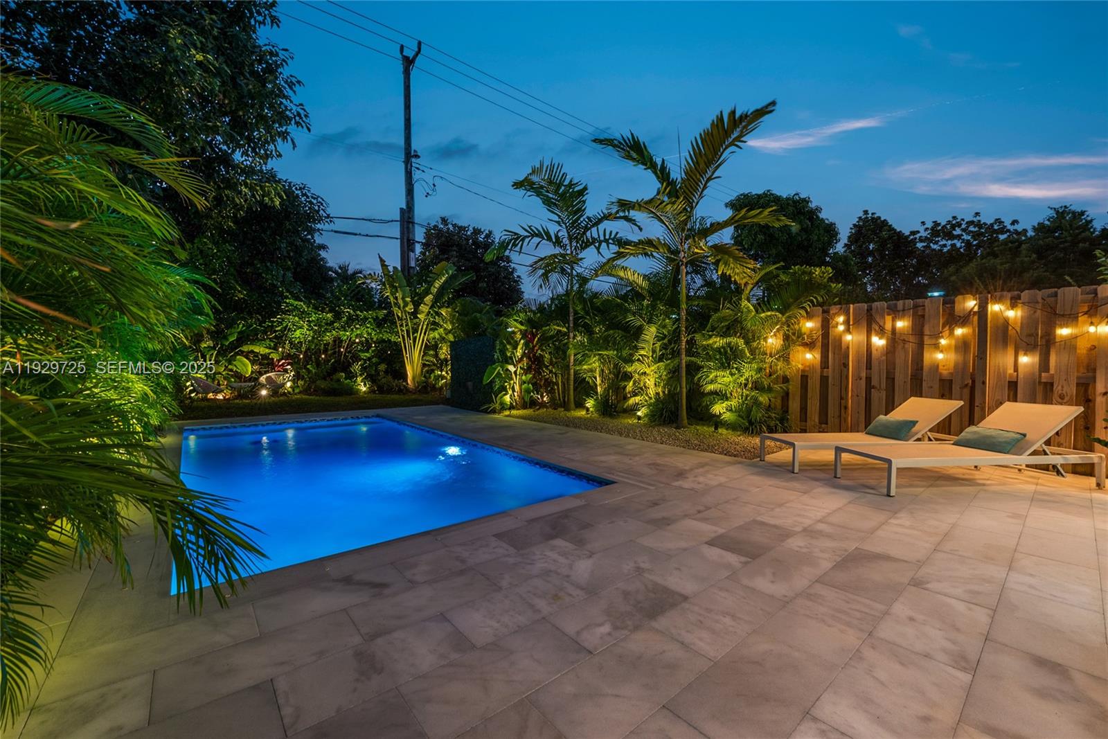 2756 Southwest 34th Court, Unit B Miami, FL 33133 - Photo 32 of 33 a view of a pool with a yard