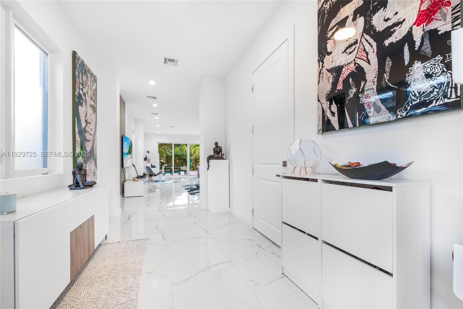 2756 Southwest 34th Court, Unit B Miami, FL 33133 - Photo 4 of 33 a view of a living room and window