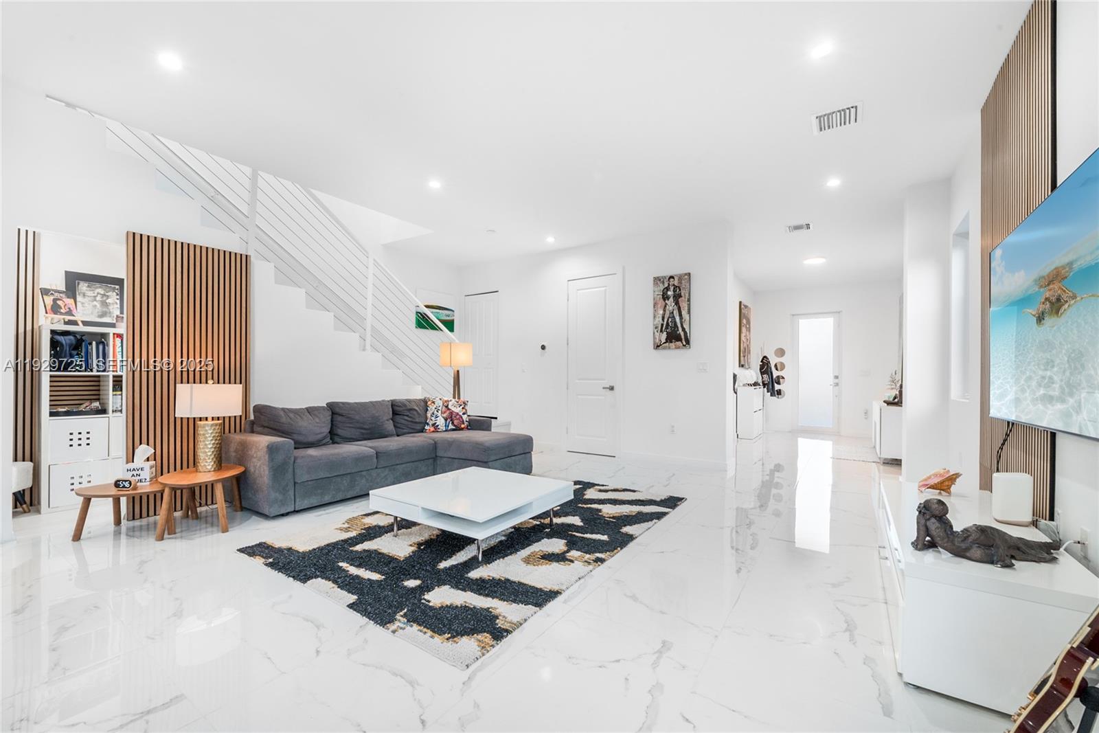 2756 Southwest 34th Court, Unit B Miami, FL 33133 - Photo 7 of 33 a living room with furniture and a flat screen tv