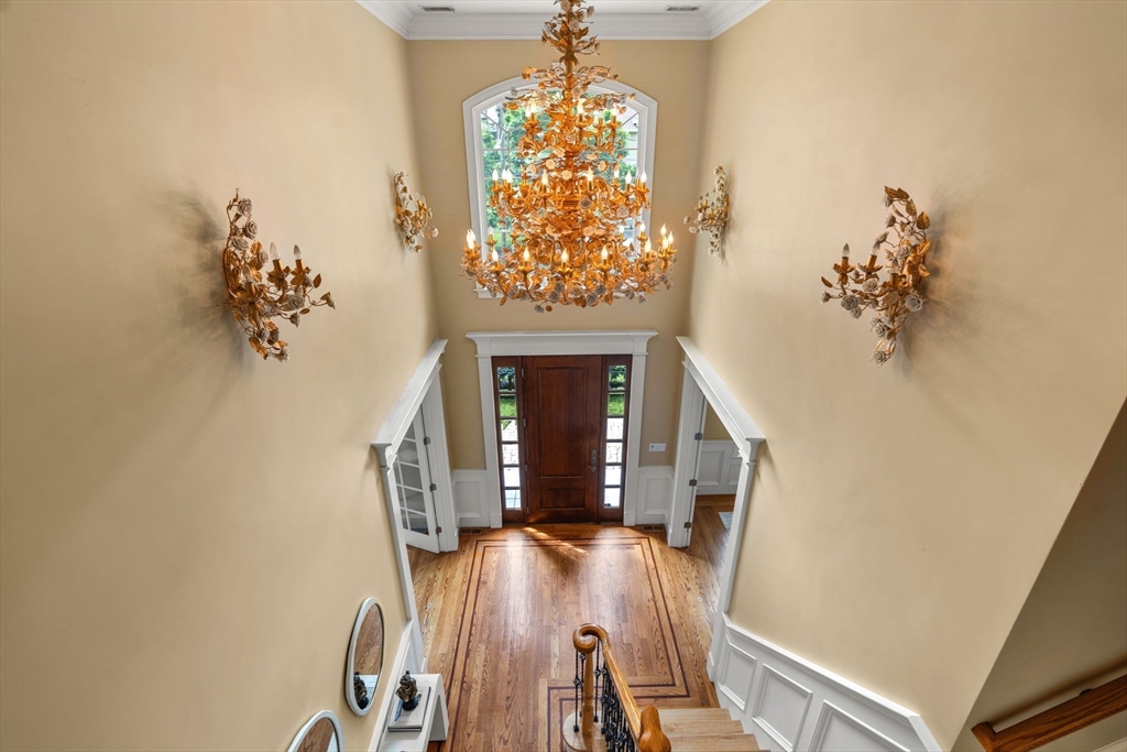 22 Scotney Road Newton, MA 02467 - Photo 8 of 42 a living room with furniture and a chandelier