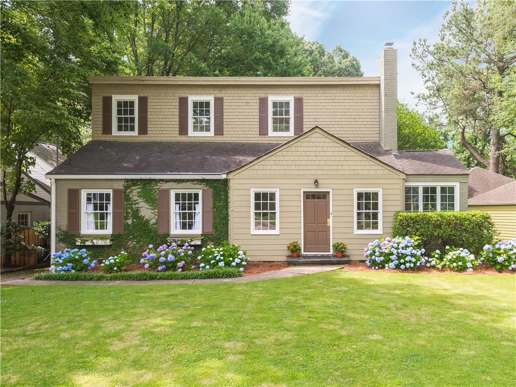 107 Mimosa Place Decatur, GA 30030 - Photo 1 of 1 a front view of a house with garden