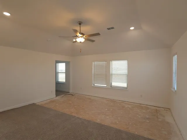 a view of empty room with windows