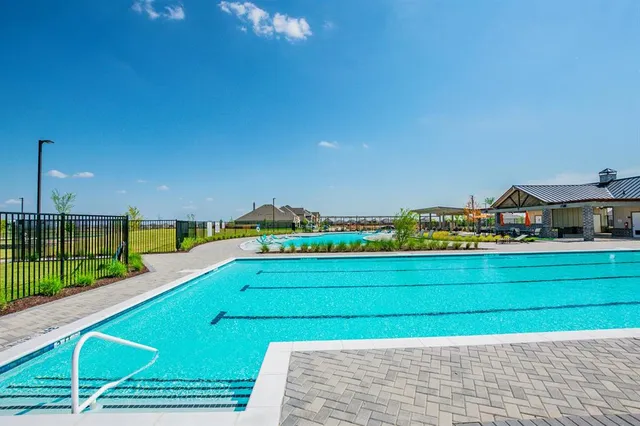 an aerial view of a house with swimming pool