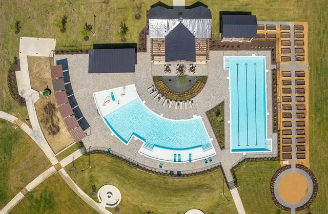 a view of a swimming pool with an outdoor seating