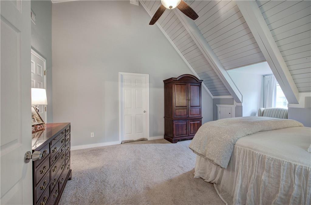 566 Old Grade Road Resaca, GA 30735 - Photo 26 of 48 a bedroom with a bed closet and mirror