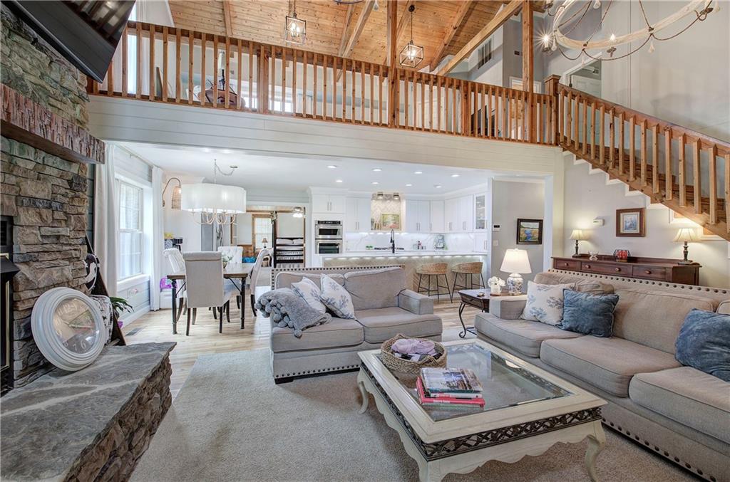 566 Old Grade Road Resaca, GA 30735 - Photo 3 of 48 a living room with furniture a rug and a chandelier