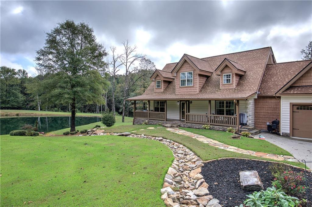 566 Old Grade Road Resaca, GA 30735 - Photo 34 of 48 a front view of a house with garden
