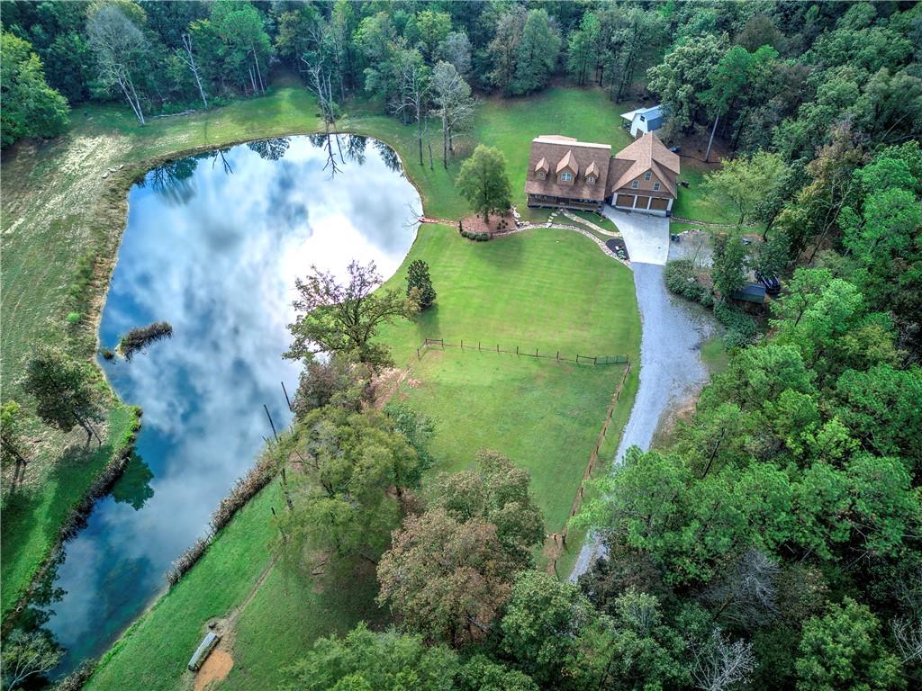 566 Old Grade Road Resaca, GA 30735 - Photo 45 of 48 an aerial view of a house with outdoor space and a lake view