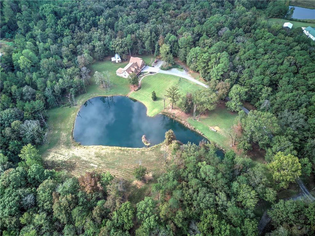 566 Old Grade Road Resaca, GA 30735 - Photo 46 of 48 an aerial view of a house with a yard and large trees